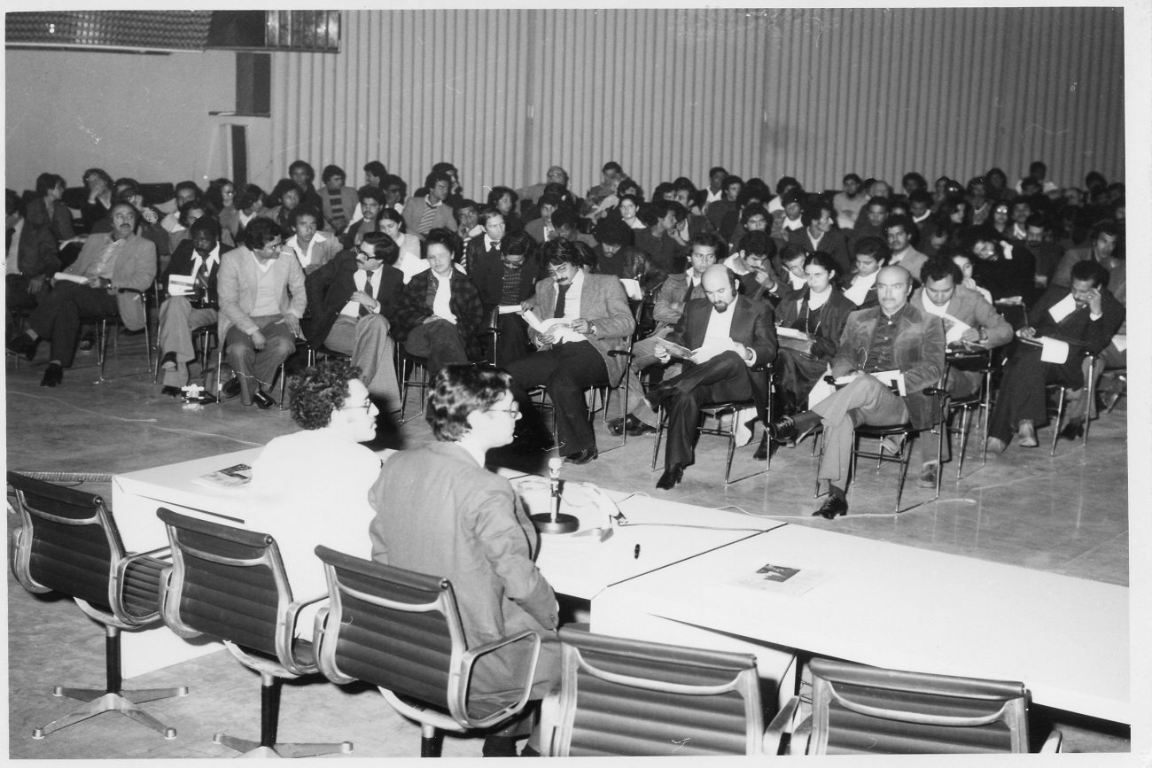 JCC 1978. Hamadi Essid, Director of the JCC, presents the program of the 2nd Colloquium on film production and distribution in African and Arab countries, advocating for the creation of a common Pan-African cinema market,<br /> with Ferid Boughedir as the designer, organizer, and rapporteur of the Colloquium.