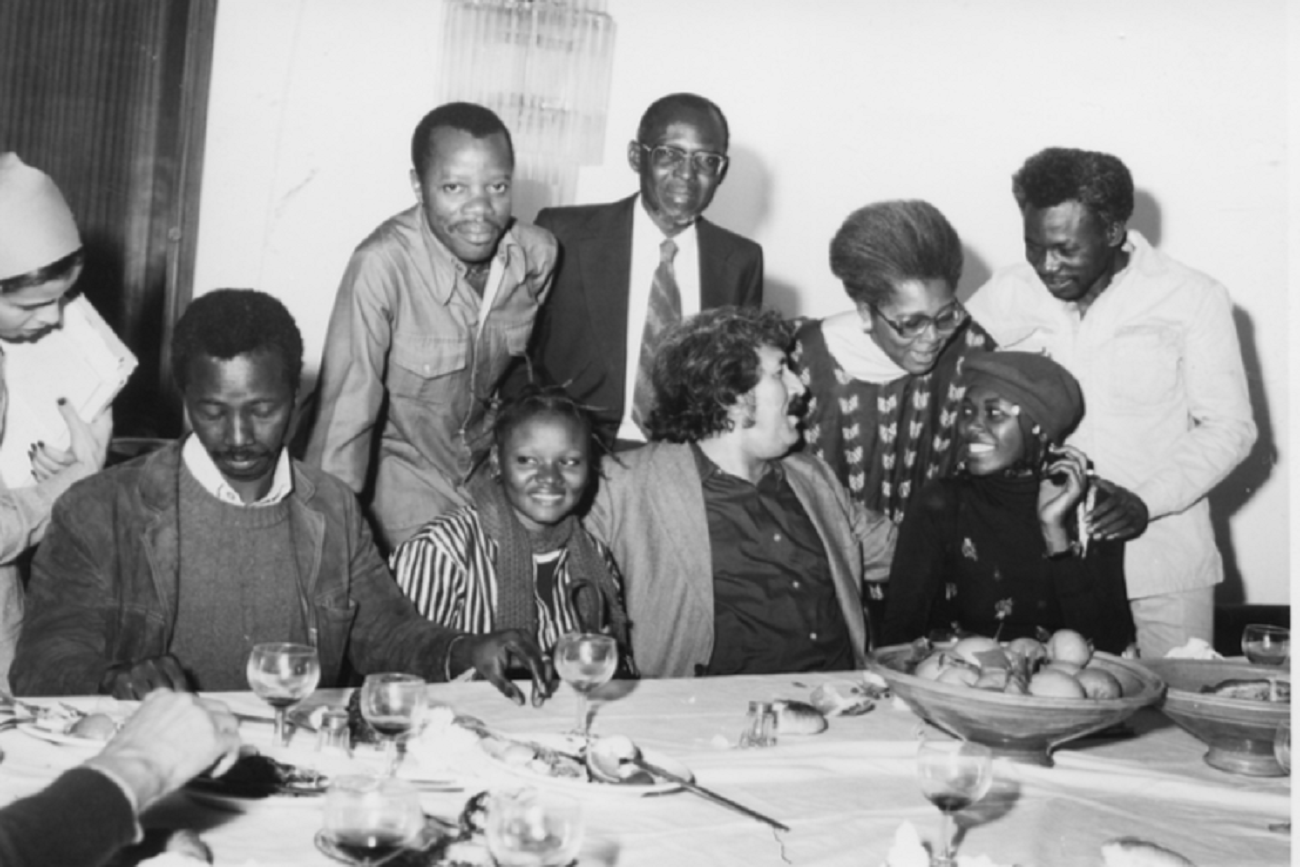 Tahar Cheriaa, affectionately known as the 'Dean,' celebrated by his friends at the 1978 JCC. From left to right: Malian director Souleymane Cissé with the actress from his film 'Baara,' an Ivorian critic, <br />Senegalese historian and filmmaker Paulin Soumanou Vieyra, Senegalese writer Annette M'baye d'Herneville, and Cameroonian director J.P. Dikongué-Pipa with the actress from his film 'Le Prix de la Liberté.