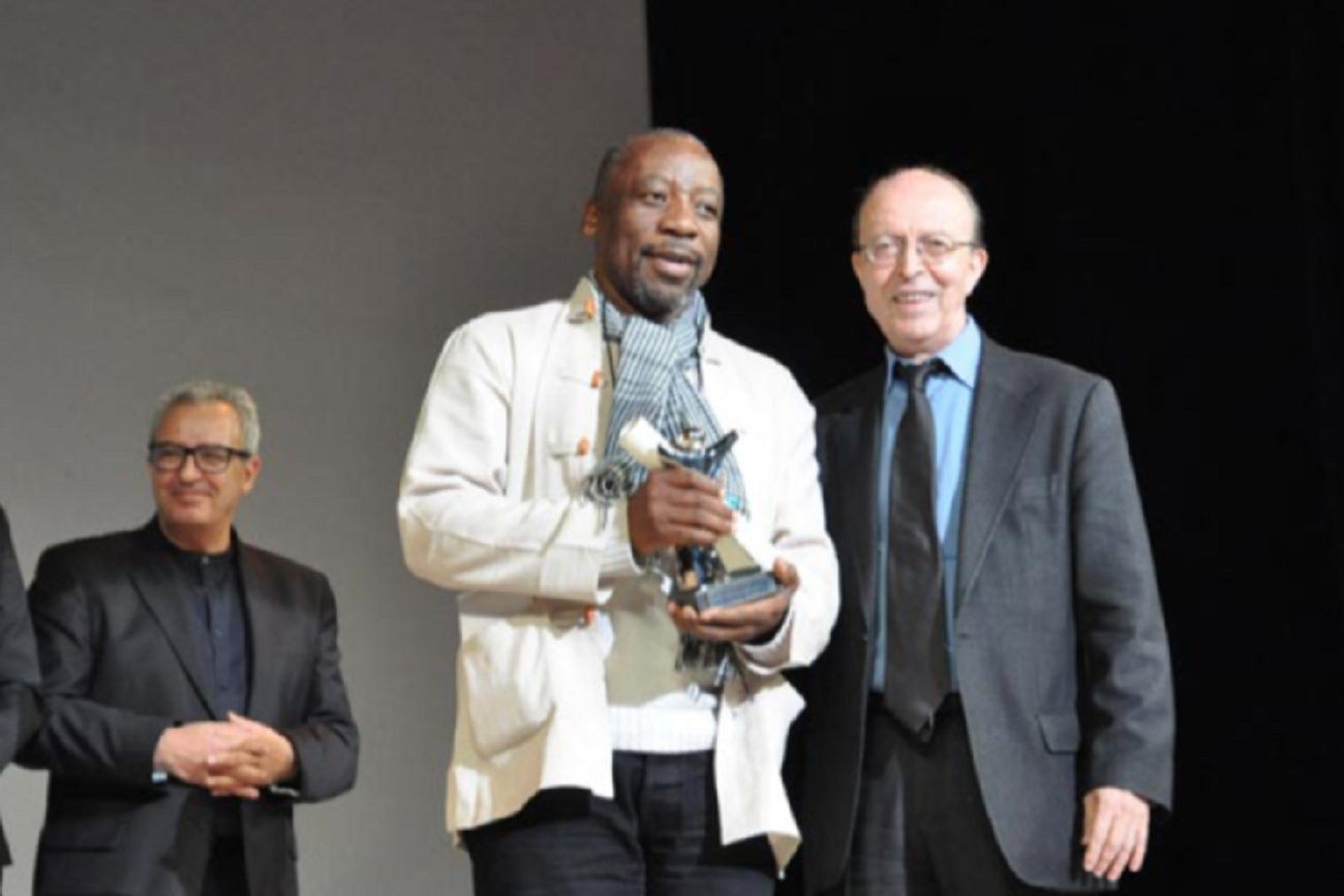 South African English-language cinema at the JCC 2015 awards. The critic Nour Eddine Sail, known as the 'father' of Moroccan cinema and President of the jury, alongside the Director of the session, Ibrahim Letaief <br />, with South African director Ramadan Suleman.
